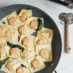 Butternut squash ravioli with sage in pan